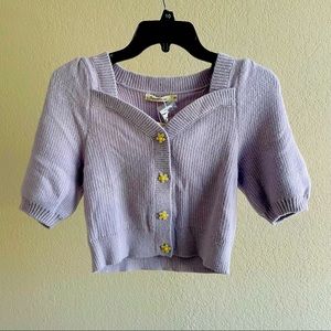 Cropped knitwear with flower buttons